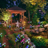Lámpara solar de 4 cabezas con forma de lirio artificial, luz LED decorativa para césped, resistente al agua IP55.